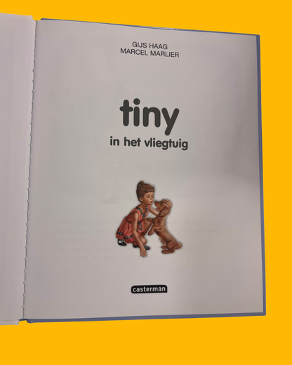 Tiny in het vliegtuig