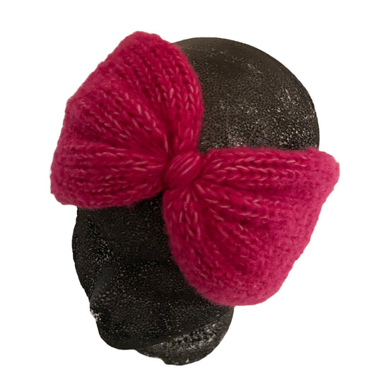 Fuchsia haarband met vlinder knoop uit stock